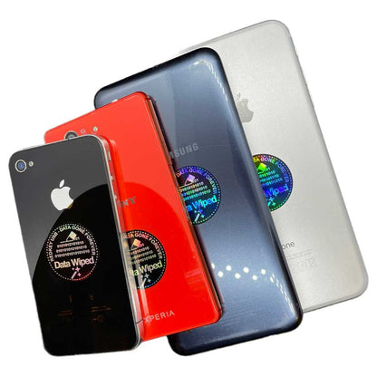Data Wiped Stickers - Roll of 5,000: stickers applied to four mobile devices